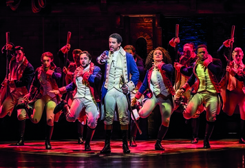 Karl Queensborough as Alexander Hamilton and ensemble - Johan Persson